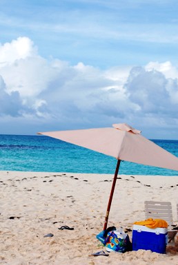 Featured is the Beach at Blue Roques, Venezuela - Caribe by Photographer Caetano Lacerda from Sao Paulo, Brazil.  There's everything you need to enjoy a day at the beach ... umbrella, towel, flip flops, cooler, chair ... yup, all the necessities!
